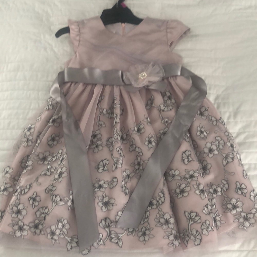 Beautiful, party dress with embroidered details.